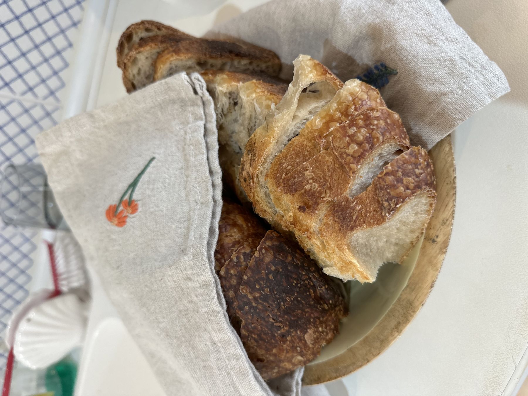 A xeixa loaf out of the banneton — baked dark, the way I like it.